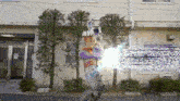 a person standing in front of a building holding a sword