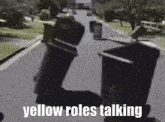 Yellow Roles Trash Cans GIF