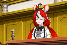 a cartoon character with red hair is sitting at a table