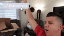 a man in a red shirt is raising his arm in front of a subscribed button
