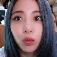 a close up of a woman 's face with a pink lip