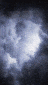 the sun is shining through the clouds in the dark sky