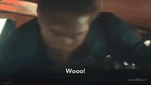 a man with a beard is screaming with the words wooo on the bottom