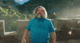 a man with a beard and a blue shirt says " i am steve "