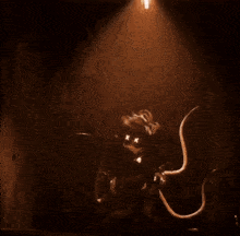a statue is lit up by a beam of light in a dark room