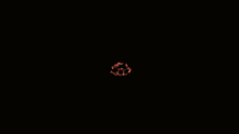 a close up of a person 's mouth with a red ribbon around it