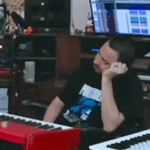 a man sits in front of a keyboard with the words do you wanna get some sushi written above him