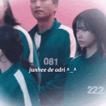 a group of people are standing next to each other and one of them has the number 222