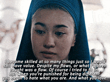 a woman wearing a blue head scarf has a quote on her face that says i became skilled at so many things just so