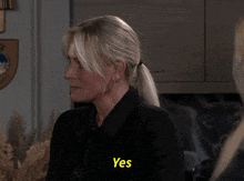a woman in a black shirt says " yes "