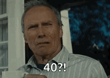 an older man is holding a cup of coffee and saying `` 40 ? ''
