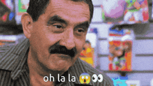 a man with a mustache says oh la la 00