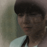 a man with a bandage on his face looks sad