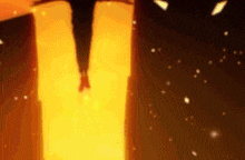 a silhouette of a person standing in front of a fire in a dark room .