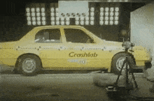 a yellow car with crashlab on the side