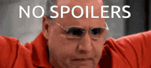 a man wearing glasses and a red shirt has the words no spoilers on his face