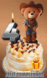 a teddy bear in a cowboy hat is on top of a cake