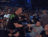 a man wearing a mask and a shirt that says sting on it