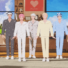five men in pajamas are standing in front of a red heart that says plave