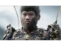 a man with a beard is wearing armor with a lion on it