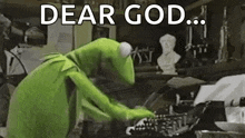 kermit the frog is typing on a typewriter .