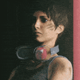 a woman wearing ear muffs and headphones looks at the camera
