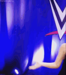 a woman in a black dress is dancing in front of a wrestling logo .