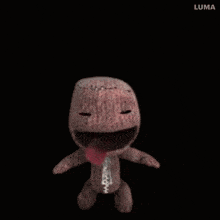 a close up of a stuffed animal with a big mouth and the word luma on the bottom