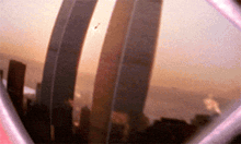a blurry picture of a city skyline with a few buildings in the background .