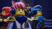 a group of lego figures are standing next to each other with one wearing headphones