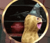a peanut wearing a witch hat is sitting in a circle .