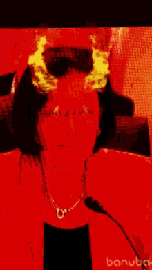 a woman with horns on her head is wearing a red jacket