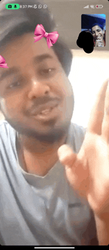 a man and woman are having a video call and the time is 13:37 pm