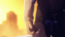 a person is holding another person 's hand in front of a yellow background