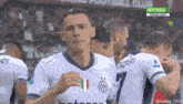 a soccer player in a white jersey with the number 7 on it