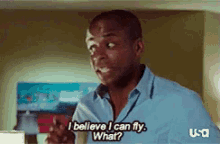 a man in a blue shirt says i believe i can fly