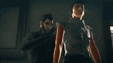a man is fighting another man in a dark room with smoke coming out of his mouth .