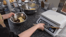 a person is using a scale that says made in animatica on it
