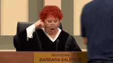 richterin barbara salesch is sitting in a courtroom with her mouth open
