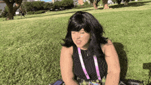 a woman with a lanyard around her neck that says ' a ' on it