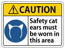 a yellow and white sign that says caution safety cat ears must be worn in this area