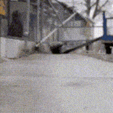 a blurry picture of a person riding a bike on a snowy road