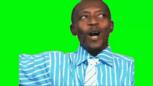 a man in a blue and white striped shirt and tie is smiling and looking up .