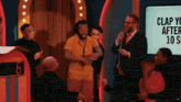 a group of people standing in front of a sign that says " clap you after 10 seconds "