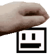 a pixelated image of a hand holding a square with a smiley face on it .