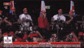 a group of people playing instruments and singing in front of a crowd with the words live at the top