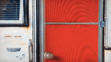 a red door with the number 702 on the side