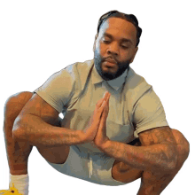 doing yoga kevin gates yoga pose meditating concentrating