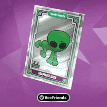 a card with a green alien on it that says adaptable alien
