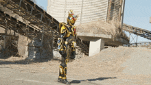 a man in a black and gold armor stands in front of a large building